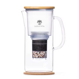 A side view of the ENYA water filter pitcher, showcasing its glass carafe, sustainable bamboo lid, and internal filter cartridge.