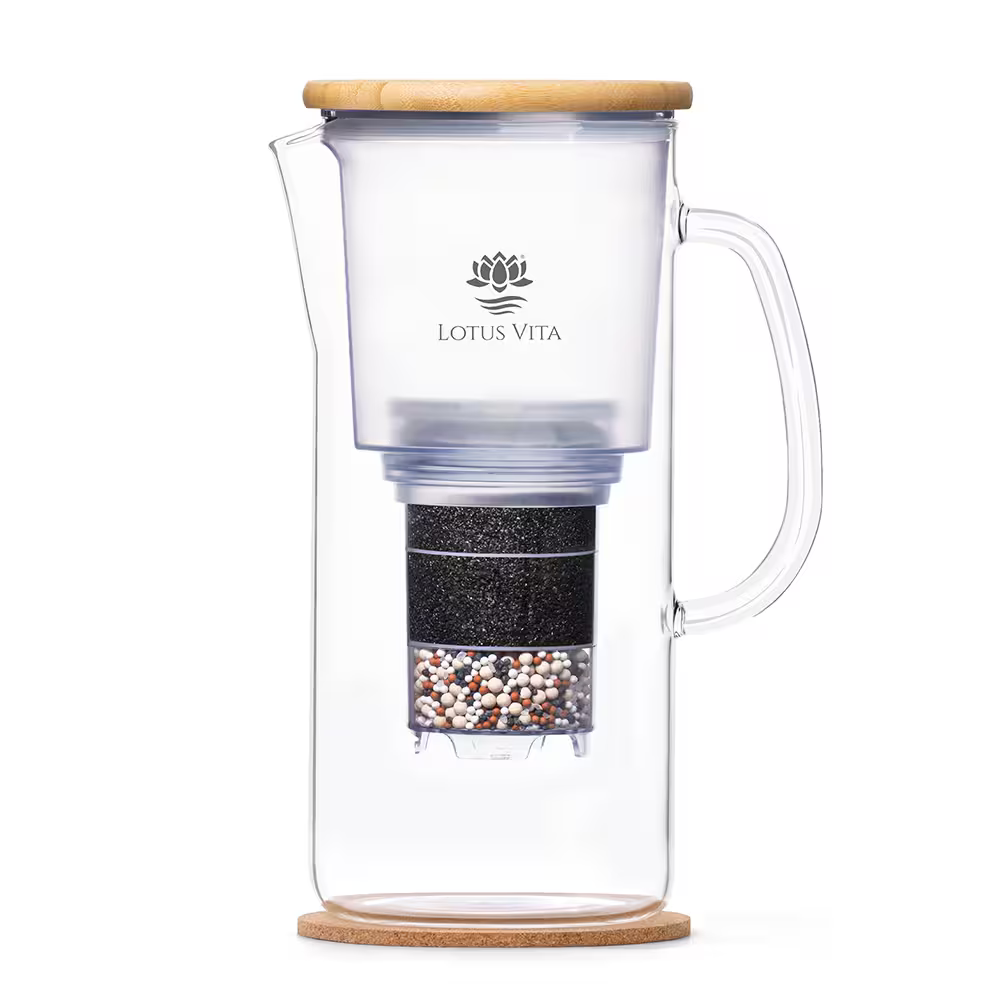 A side view of the ENYA water filter pitcher, showcasing its glass carafe, sustainable bamboo lid, and internal filter cartridge.